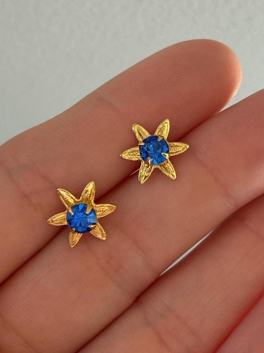 Blue and gold star earrings without backs